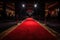 red carpet for celebrity awards ceremony, with view of the stage and audience visible in the background