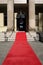 Red carpet, celebrity hotel or theater entrance, vertical, copy space