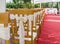 Red carpet and decorations at a wedding ceremony.