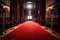 the red carpet leading up to a classic movie theatre