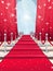 A Red Carpet With Silver Poles And Red Curtains