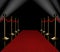 Red carpet with spotlights and stanchions on the side