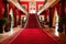 red carpet stretching through the grand foyer of an elegant mansion