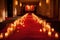 red carpet surrounded by lit candles, creating warm and welcoming setting