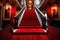 a red carpeted staircase, leading to a glamorous event