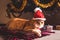 Red cat wears Santa`s hat under Christmas tree. Christmas and New year concept