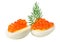 Red caviar canape with quail egg and dill twig