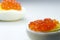 Red caviar on half eggs, unusual perspective, copy space