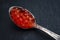 Red caviar in a silver spoon