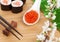 Red caviar, sushi set, sakura branch and chopsticks