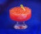 Red caviar in vase on blue background