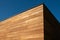 Red cedar siding wood facade architecture on blue sky background