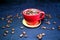 Red ceramic espresso cup with coffee beans