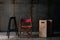 red chair, stool and boxes in loft interior