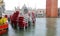 Red chairs of the alfresco cafe in Saint Mark Square  flooded du