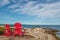 Red chairs facing Keji Seaside beach (South Shore, Nova Scotia,