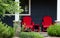 red chairs on a front porch