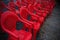 Red chairs sorted accordingly before an event. Selectively focused and blurry when viewed