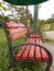 Red chairs to relax in the middle of the garden