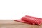 Red checkered napkins on wooden table. Mockup for design