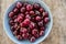 Red cherries in antique bowl