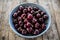 Red cherries in antique bowl