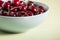 Red cherries in antique bowl