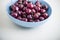 Red cherries in antique bowl