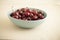 Red cherries in antique bowl