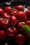 red cherries with water drops on black stone - closeup - generative AI