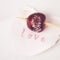 Red cherry sugar coated on a stick with word love