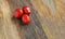 Red cherry three tomatoes on a wooden background close-up vegetable set