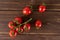 Red cherry tomato on brown wood
