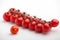 Red cherry tomatoes close-up white background