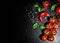 Red chili peppers, cherry tomato, basil, black pepper, salt on dark wooden background with copy space. top view