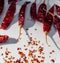 Red Chili Peppers, Chili Pepper Flakes shown against a white background