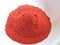 Red chili peppers powder on white background