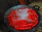 Red chilies being boiled in boiling water