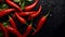 red chilies on a black board