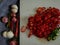 red chilies, green chilies, garlic, shallots and chili slices on a cutting board