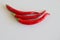 Red chilli isolated on white background. Selective focus. Blurred background. Free place for text