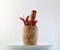 Red chillies with mortar and pestle on white background