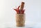 Red chillies with mortar and pestle on white background