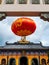 Red Chinese lantern hanging at the doorway of a Chinese Taoist temple
