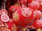 red chinese paper lanterns and hanging ornament in storefront in thai chinatown