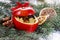 Red christmas apples stuffed with dried fruits in honey on fir b