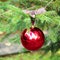 Red Christmas ball with checkered ribon