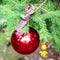 Red Christmas ball with checkered ribon