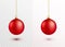 Red christmas ball hanging on gold string isolated on white background