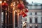 Red Christmas balloons with decorated pines branches on the background of an illuminated winter street. Merry Christmas. Happy